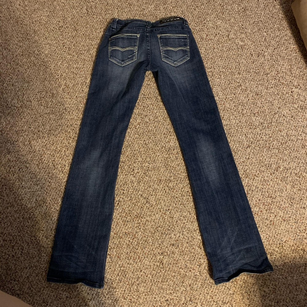 Rock and Roll Cowgirl riding jeans